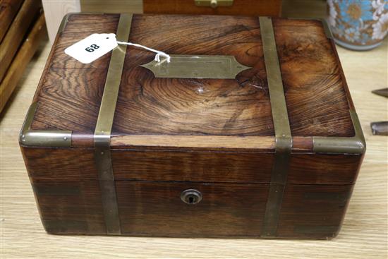 An early Victorian brass mounted rosewood toilet box with fitted plate, mounted interior width 30cm depth 21cm